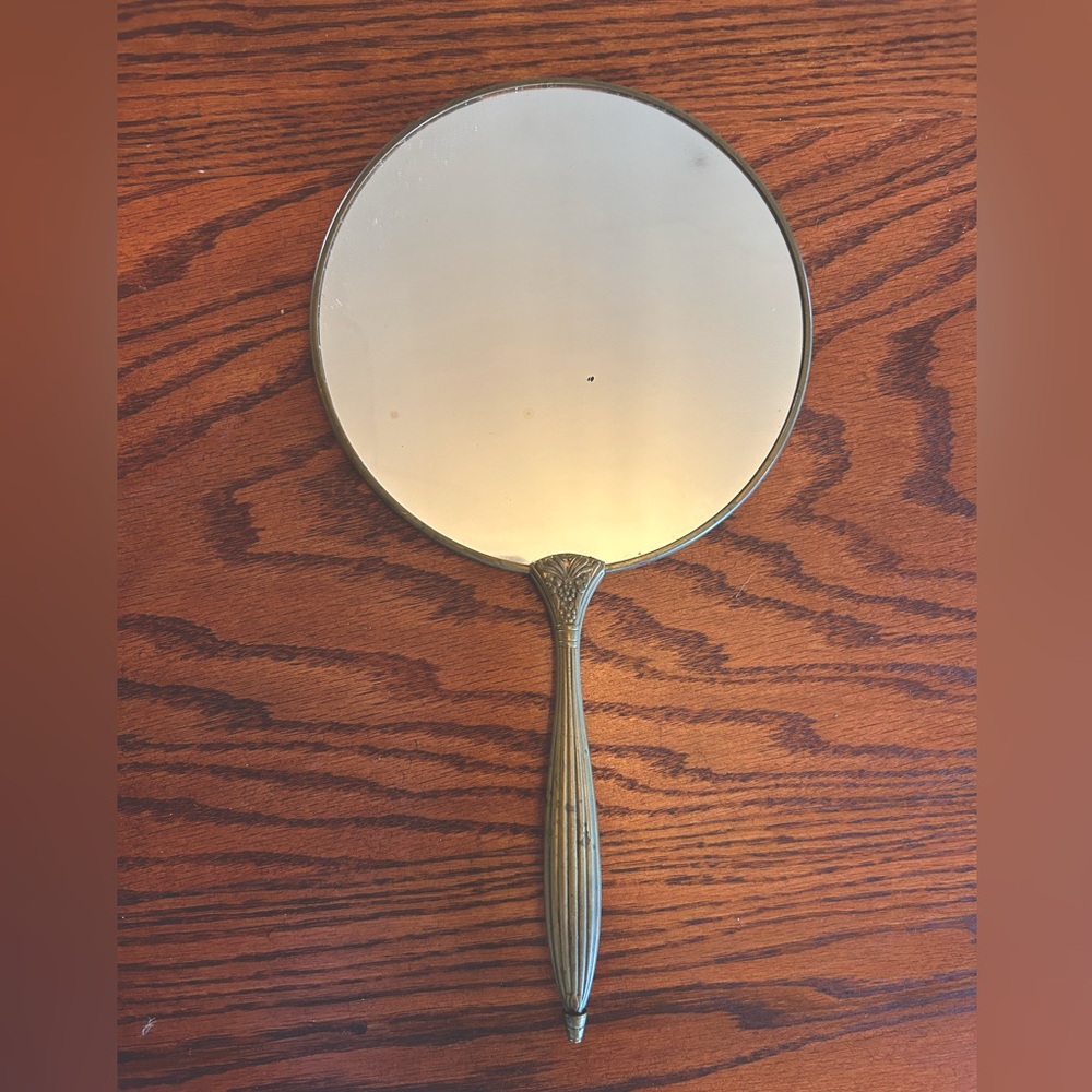 Antique brass hand mirror